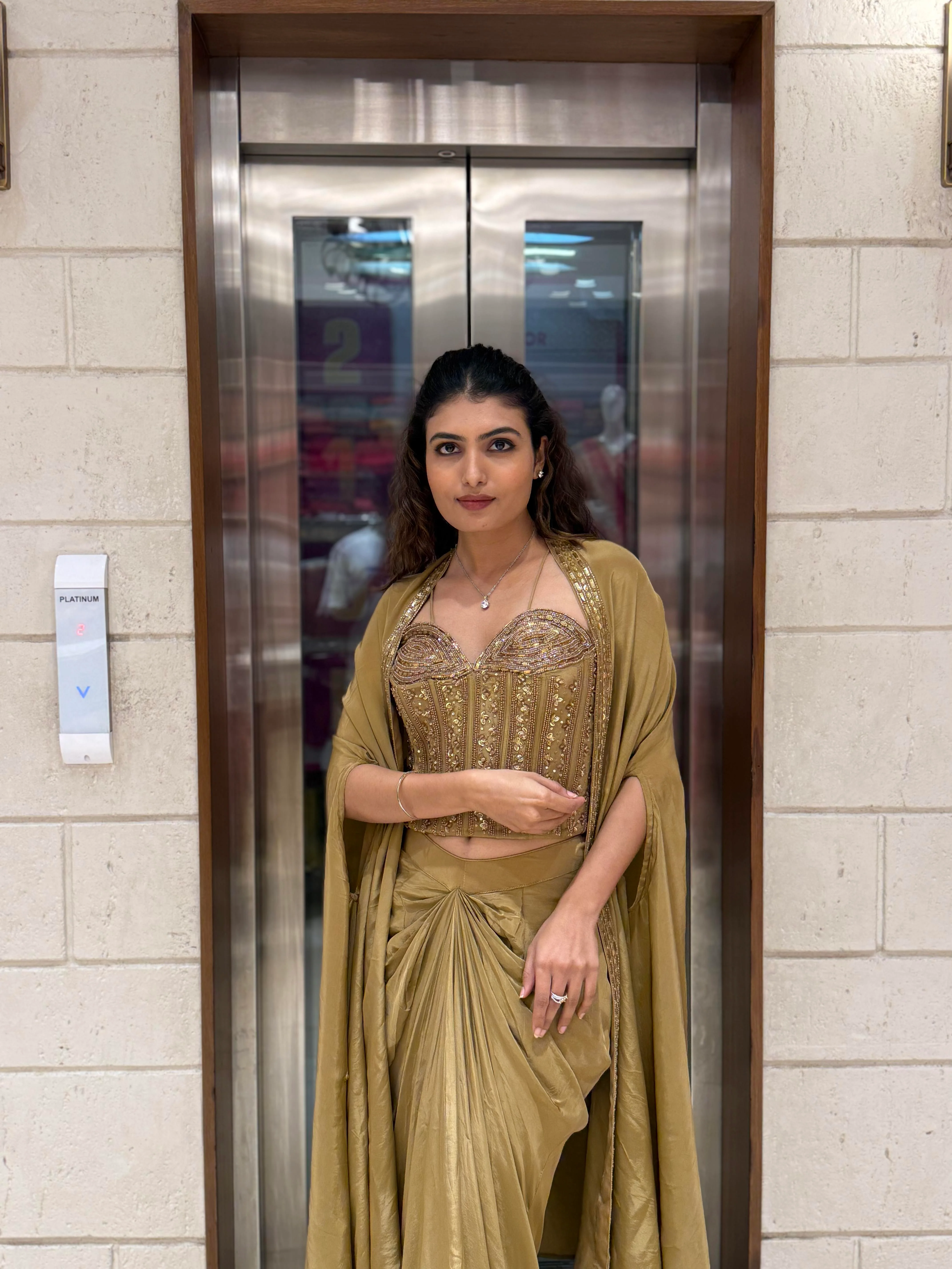 Champagne Gold Draped Saree Set with Embroidered Corset Blouse & Cape - Image 5