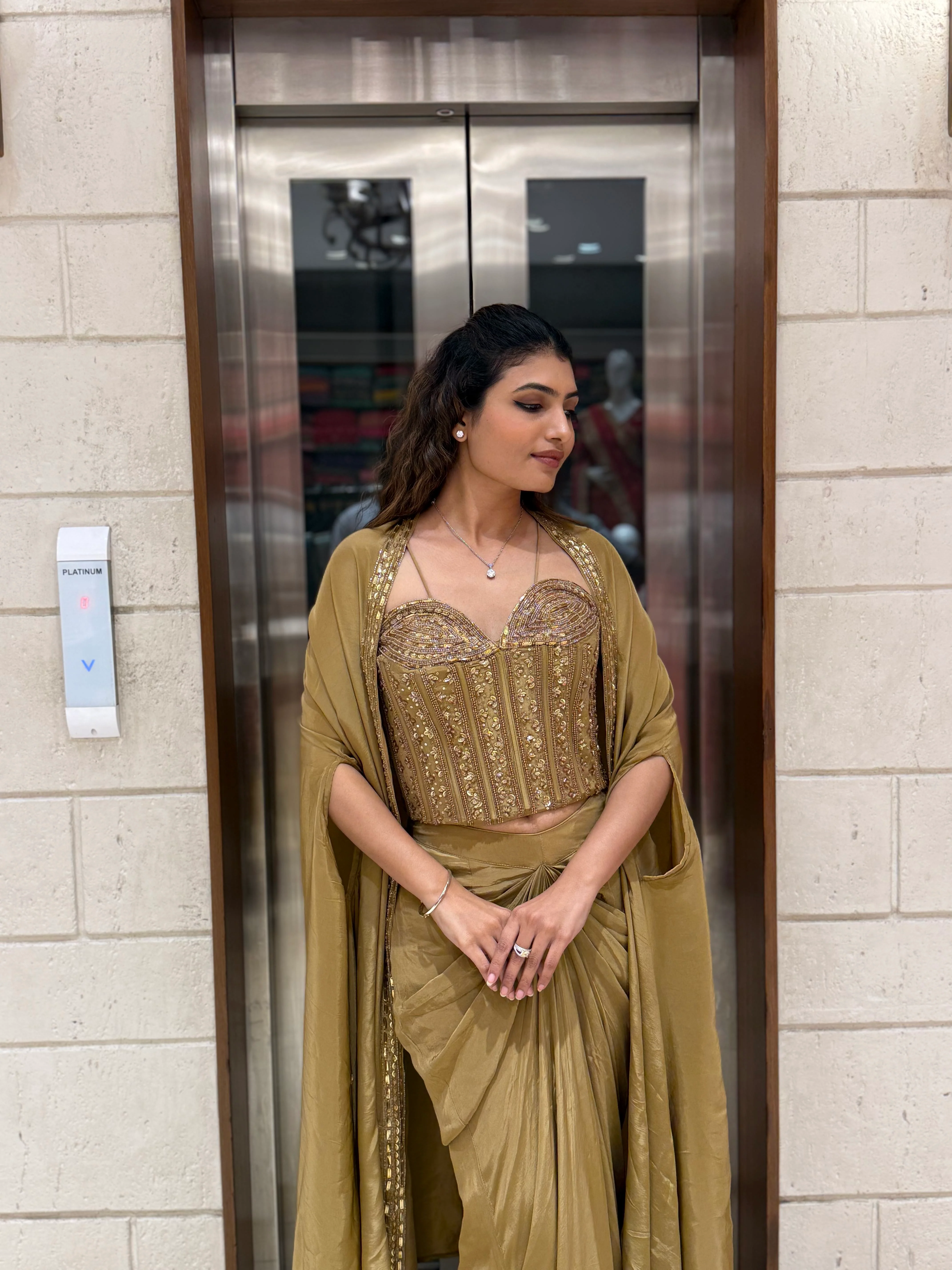 Champagne Gold Draped Saree Set with Embroidered Corset Blouse & Cape - Image 6