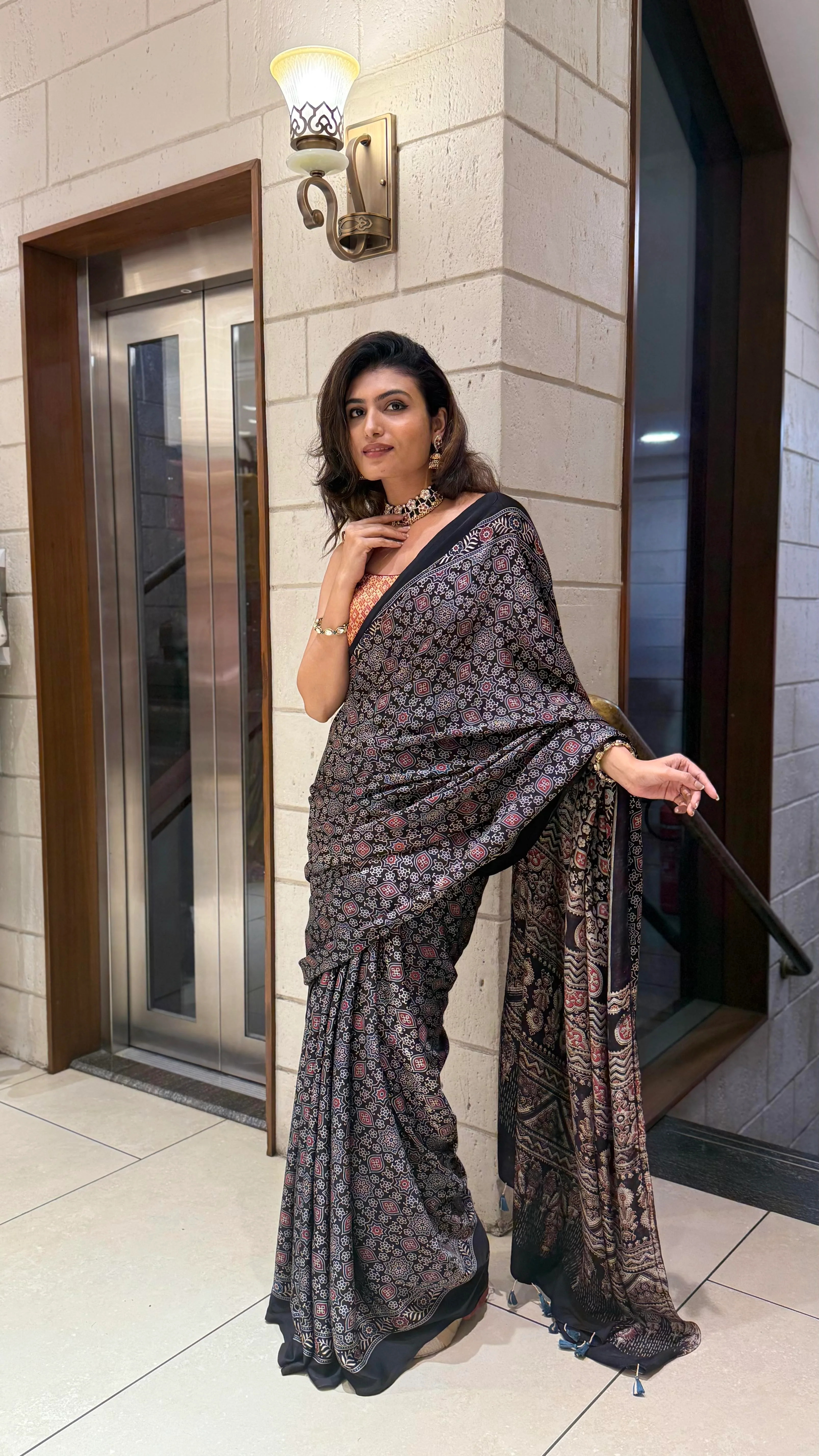 Luxury Black Ajrakh Printed Satin Silk Saree with Copper Blouse & Handcrafted Tassel Pallu - Image 3