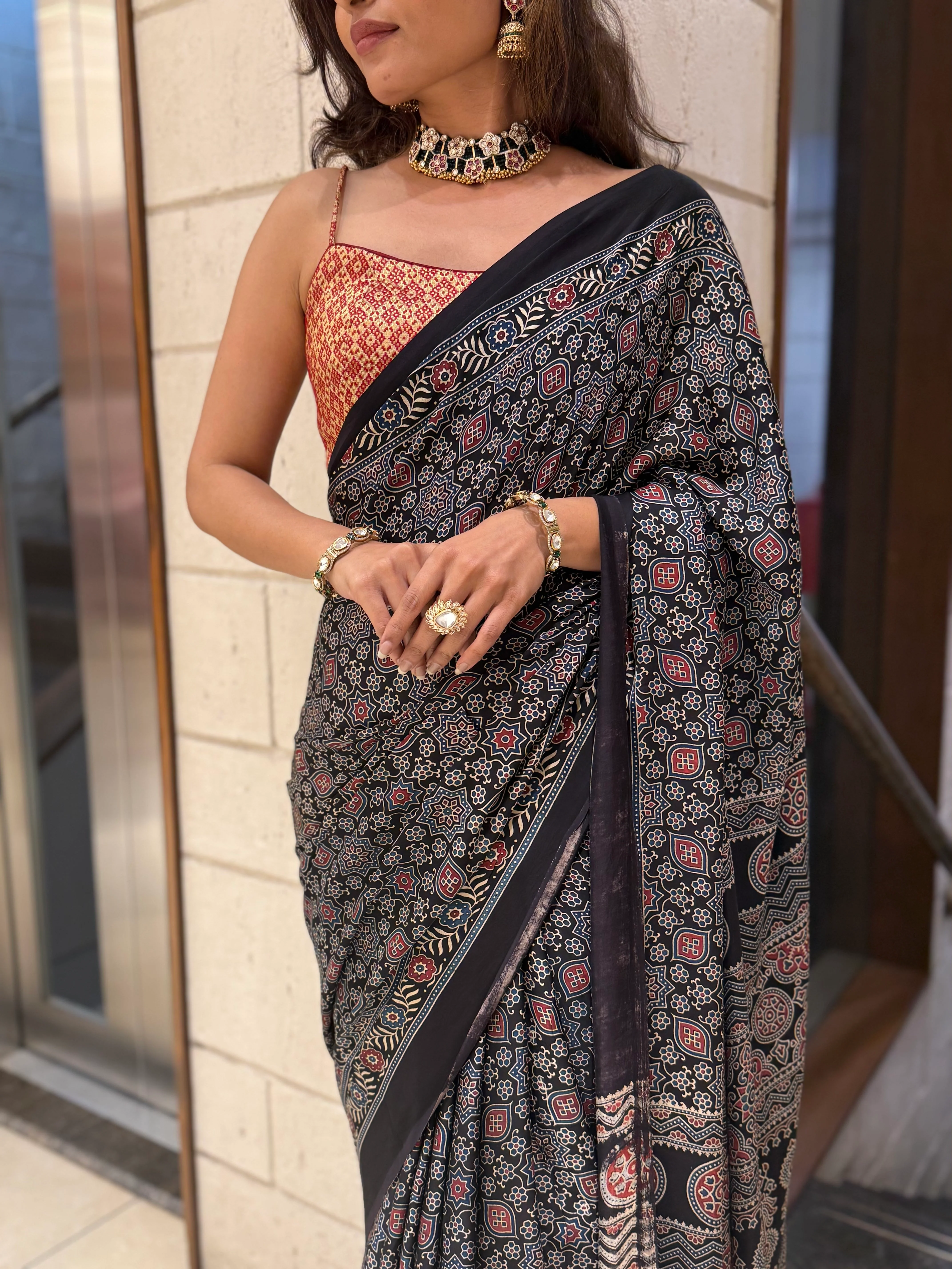 Luxury Black Ajrakh Printed Satin Silk Saree with Copper Blouse & Handcrafted Tassel Pallu - Image 4