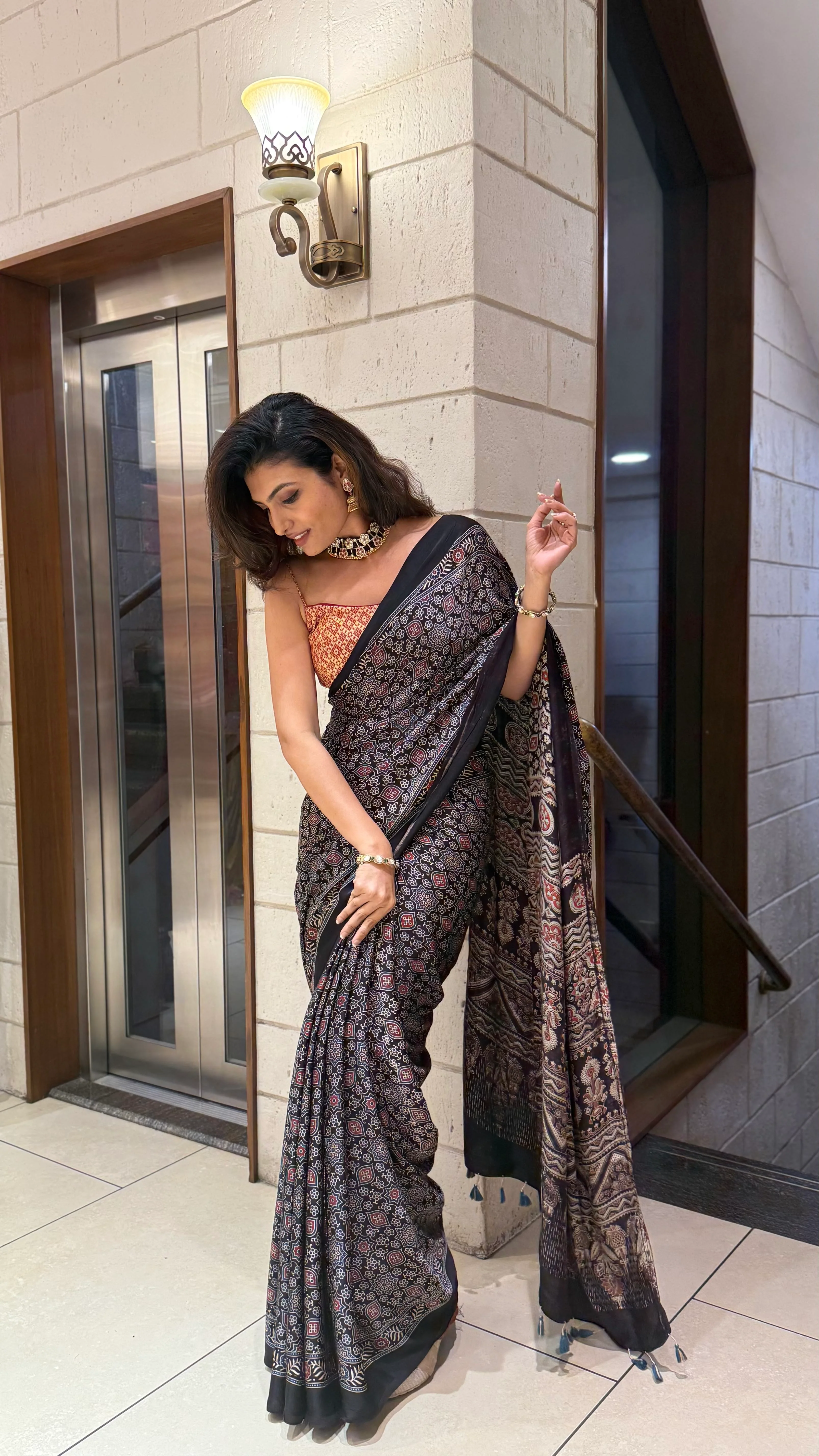 Luxury Black Ajrakh Printed Satin Silk Saree with Copper Blouse & Handcrafted Tassel Pallu - Image 5