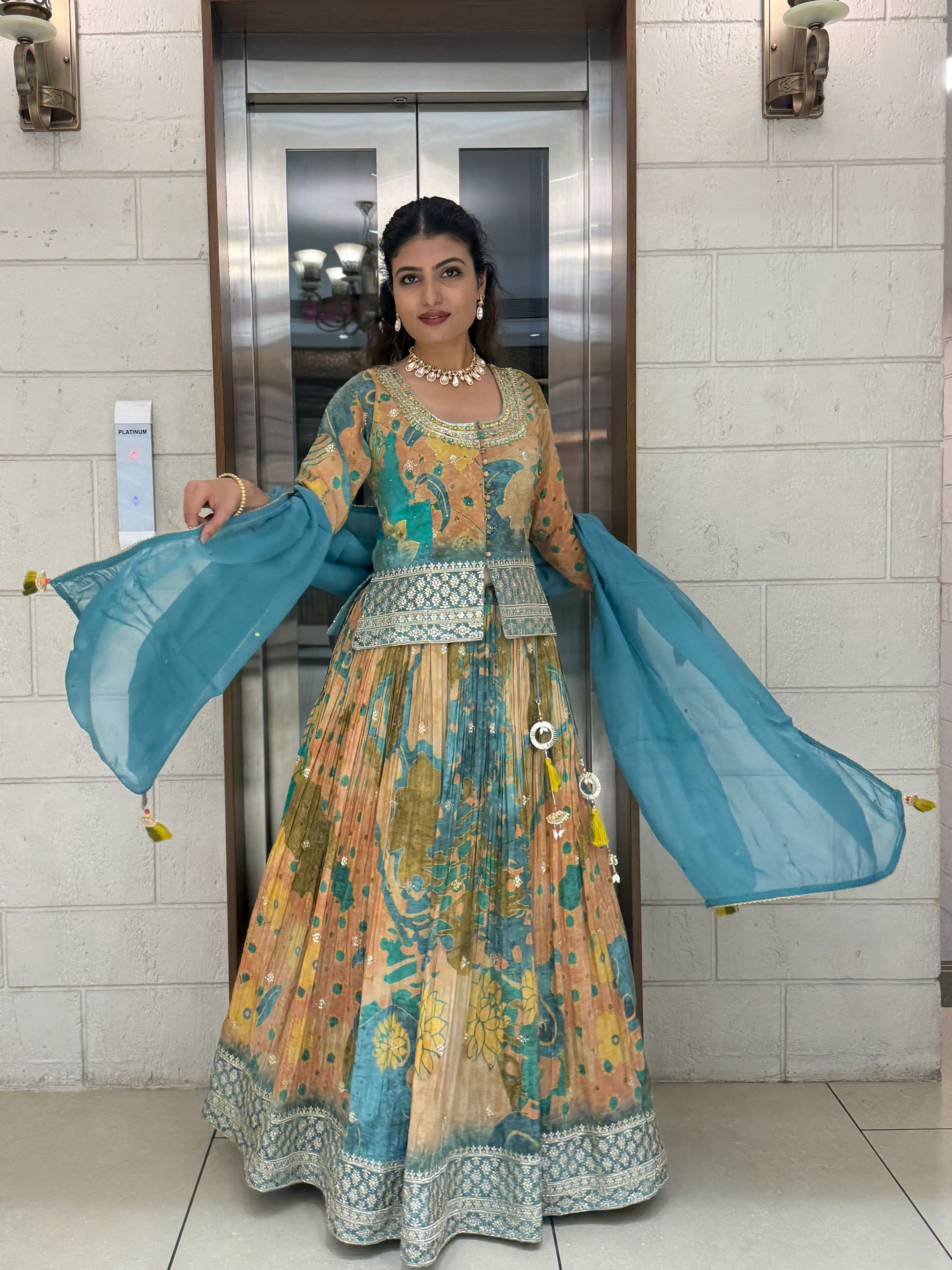 Teal Blue & Peach Printed Designer Peplum Lehenga Set with Flared Sleeves & Tassel Accents - Image 4