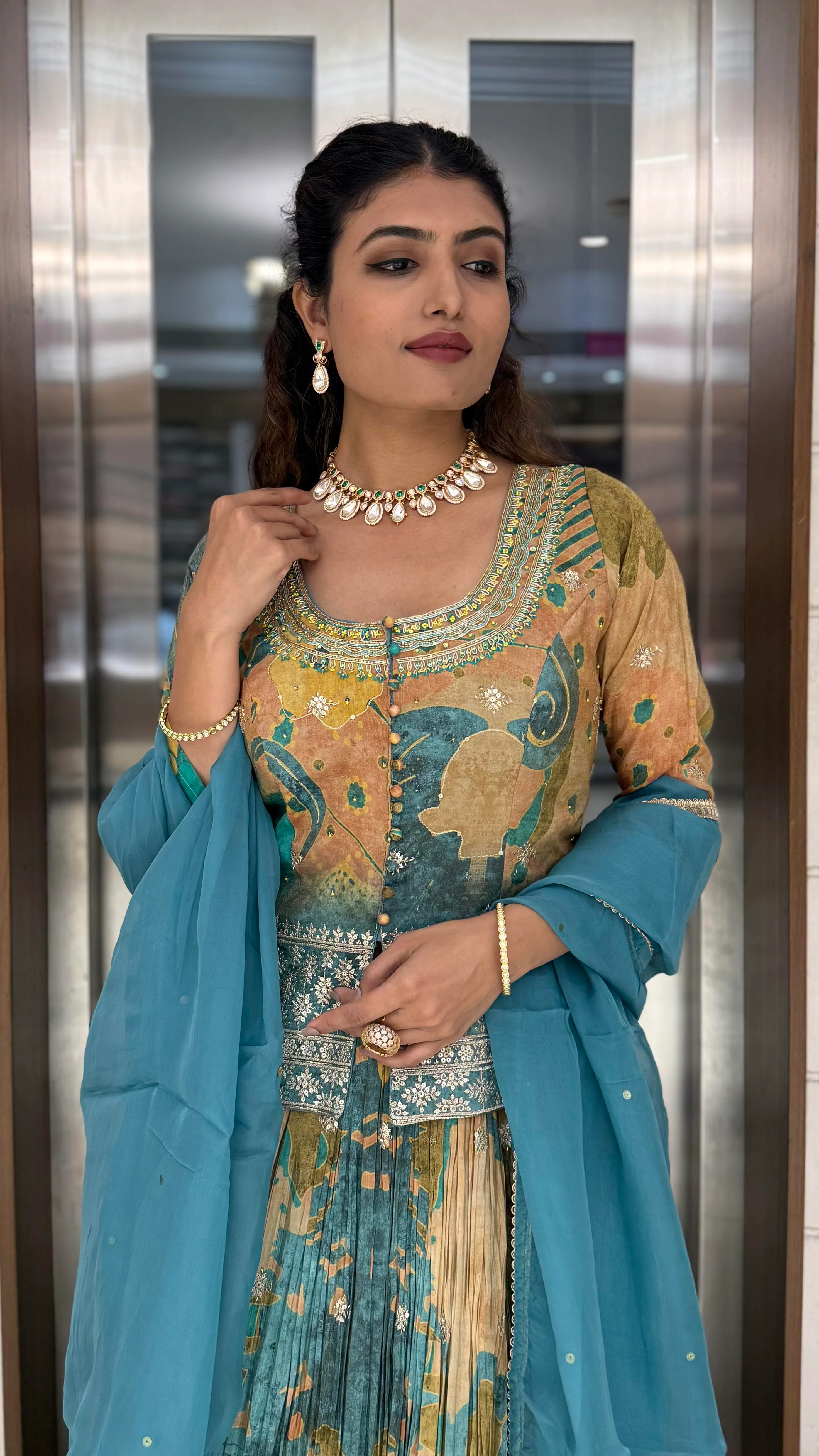 Teal Blue & Peach Printed Designer Peplum Lehenga Set with Flared Sleeves & Tassel Accents - Image 6